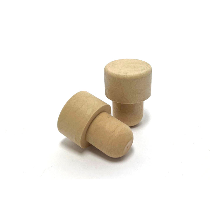Two wooden wine bottle plugs on a white background